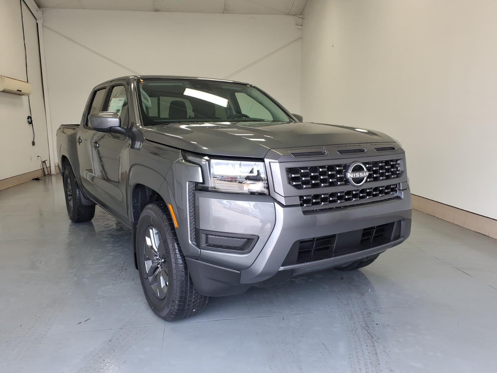 2026 Nissan Frontier SV in Gun Metallic Kad — front three-quarter view
