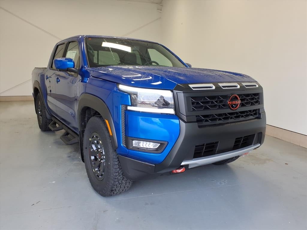 2026 Nissan Frontier PRO-X in Bluestone Pearl Rcf — front three-quarter view