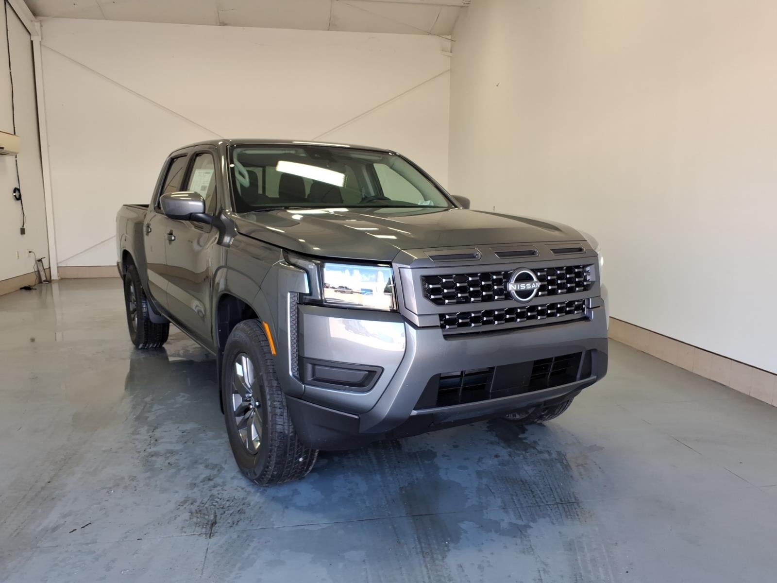 2026 Nissan Frontier SV in Gun Metallic Kad — front three-quarter view