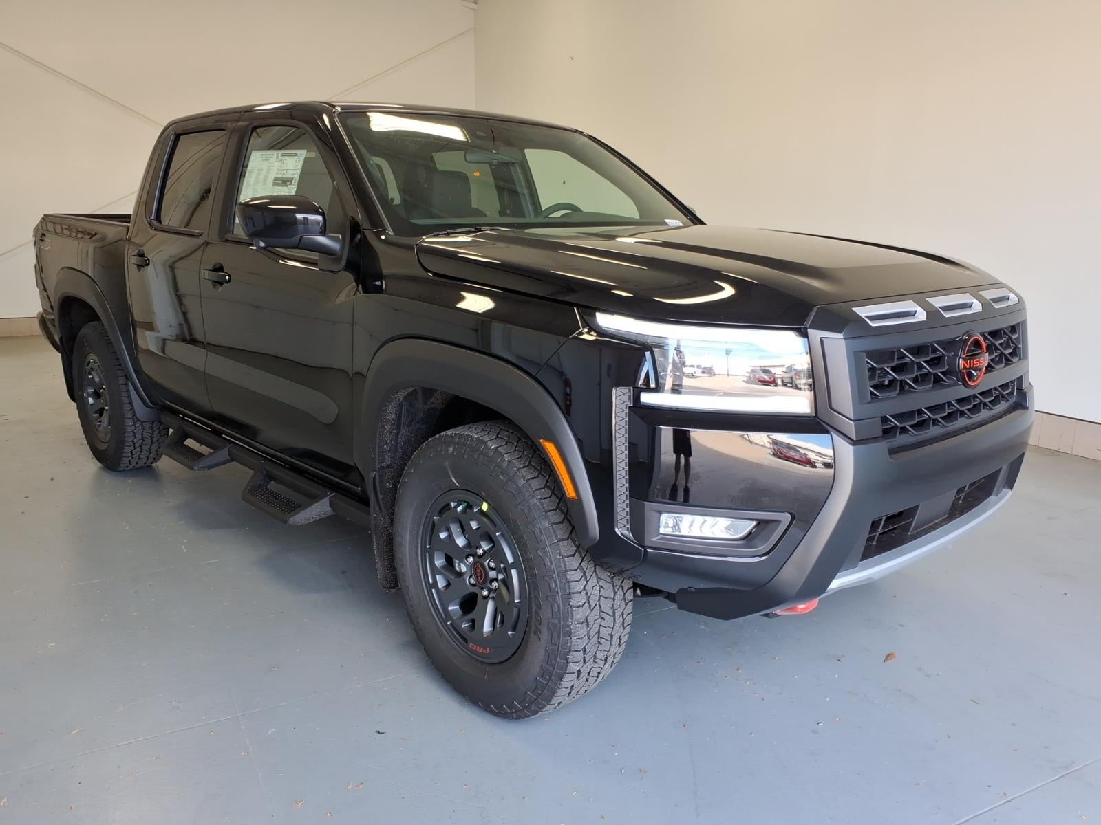 2026 Nissan Frontier PRO-4X in Super Black Kh3 — front three-quarter view