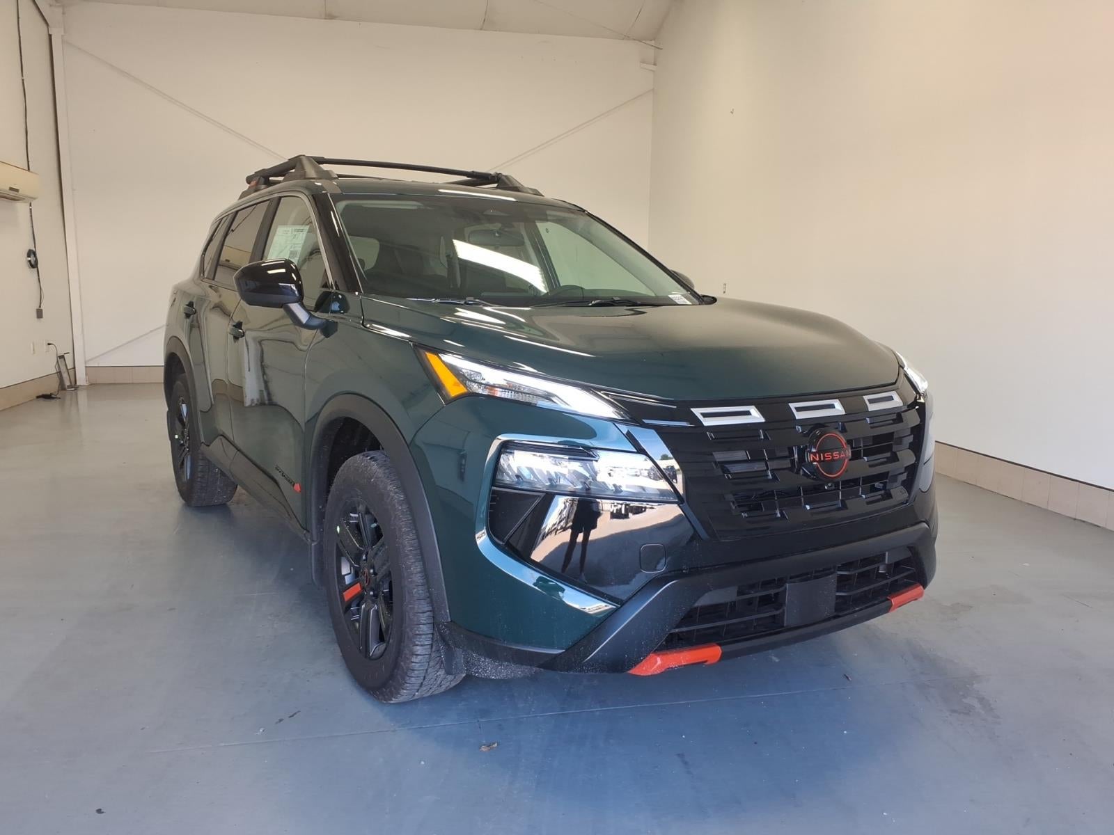 2026 Nissan Rogue Rock Creek in Obsidian Green Pearl Dan — front three-quarter view
