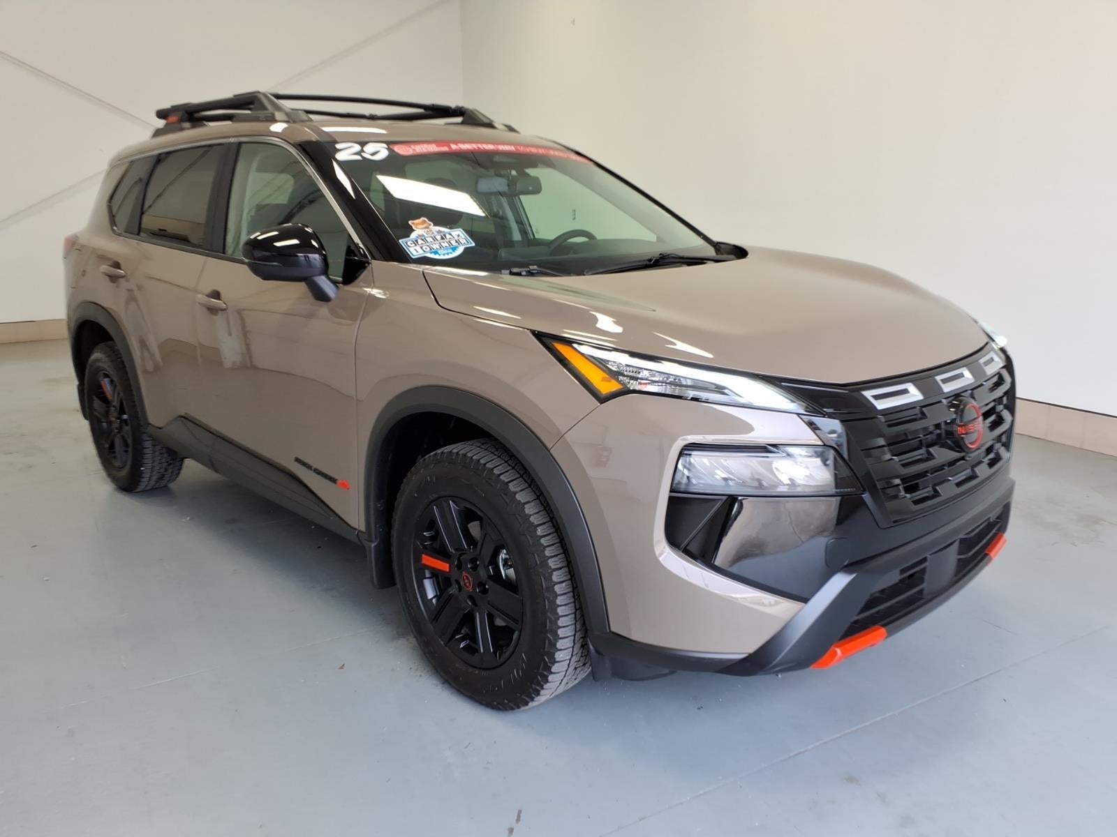2025 Nissan Rogue Rock Creek in Baja Storm Metallic (Hal) — front three-quarter view