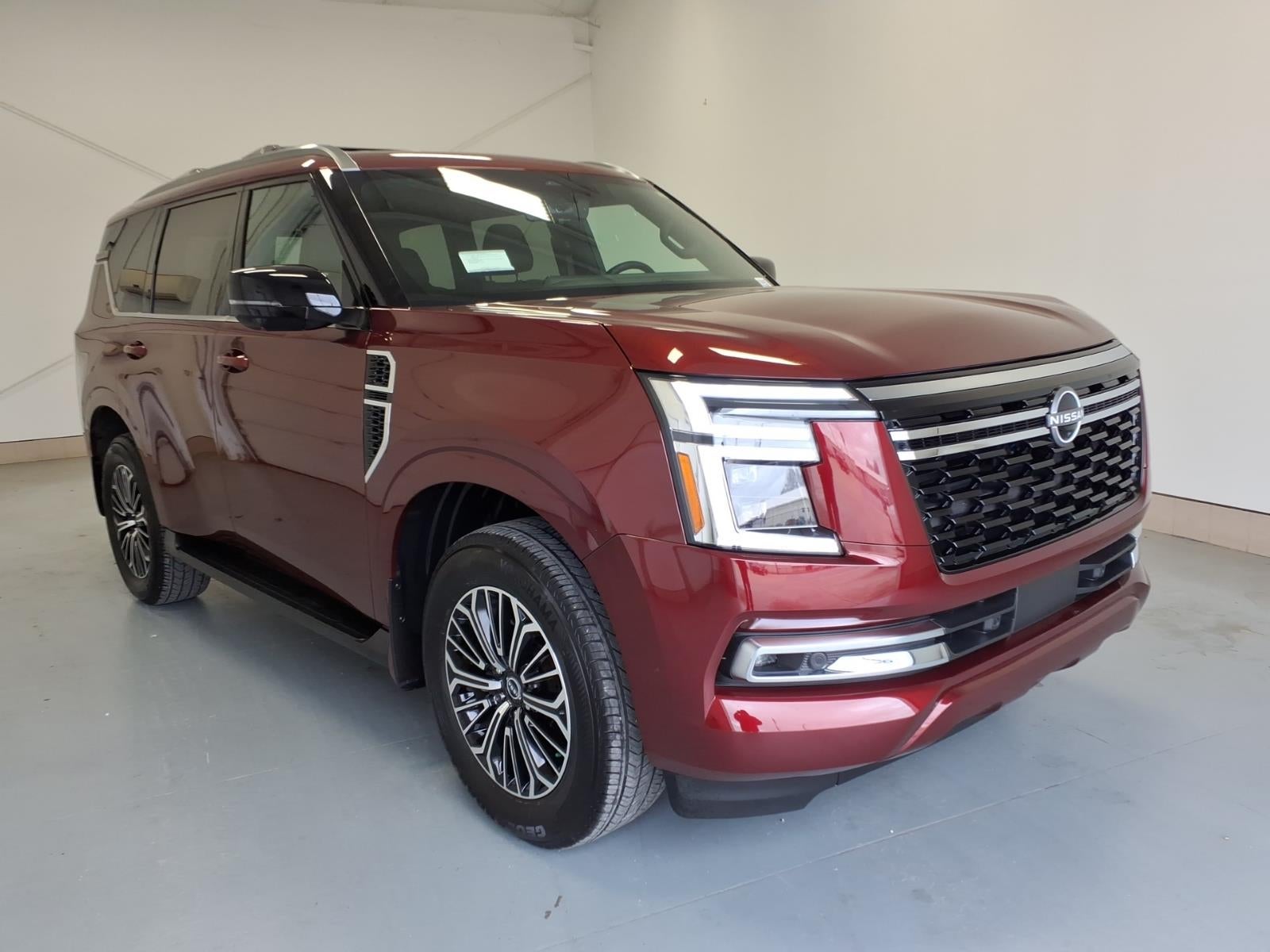 2026 Nissan Armada Platinum in Coulis Red Pearl Naw — front three-quarter view