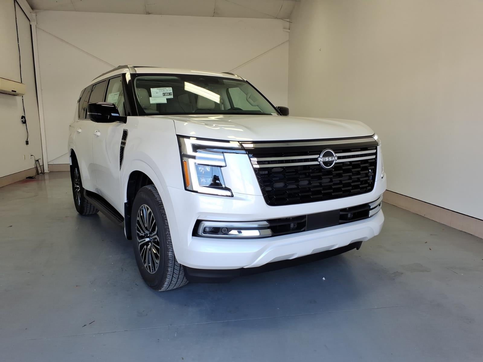 2026 Nissan Armada Platinum in Aspen White Tricoat Qac — front three-quarter view