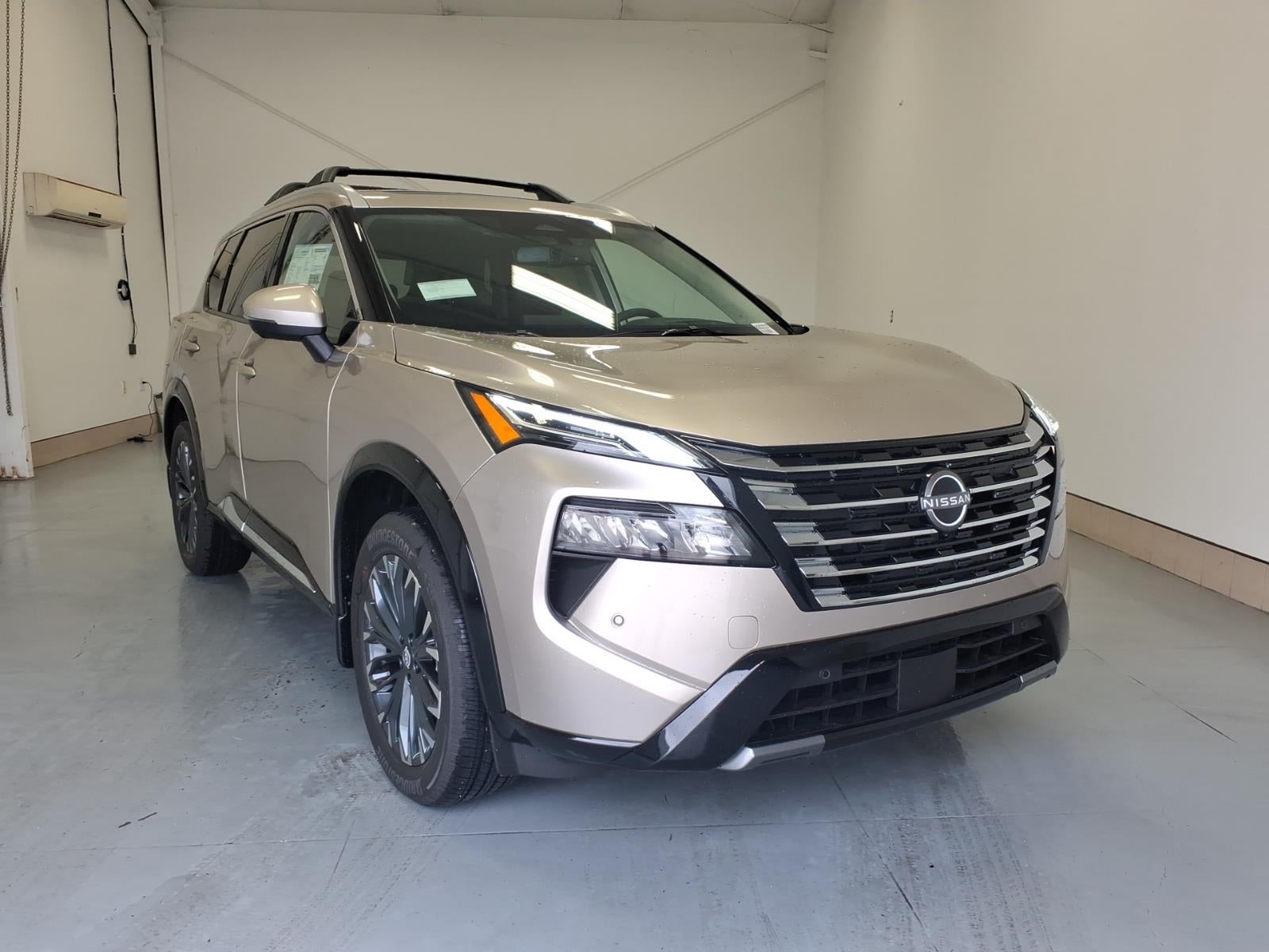 2026 Nissan Rogue Platinum in Champagne Silver Metallic Kay — front three-quarter view