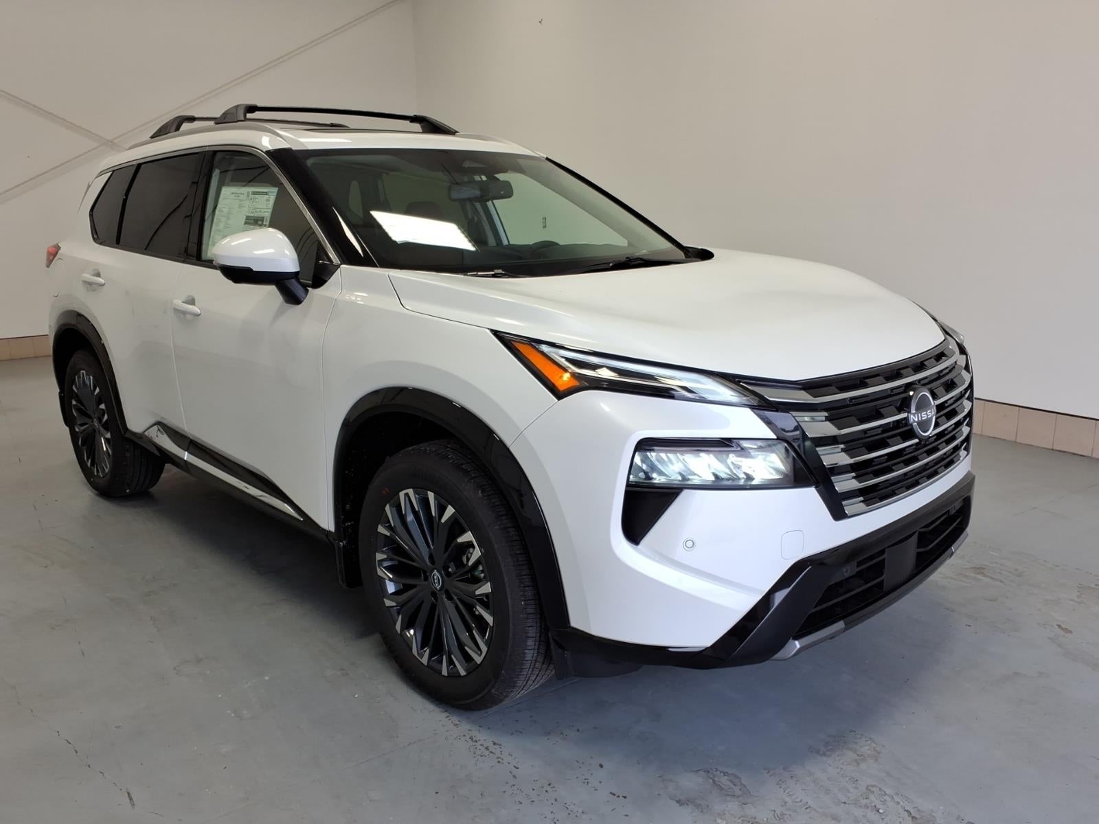 2026 Nissan Rogue Platinum in Everest White Pearl Tricoat Qbe — front three-quarter view